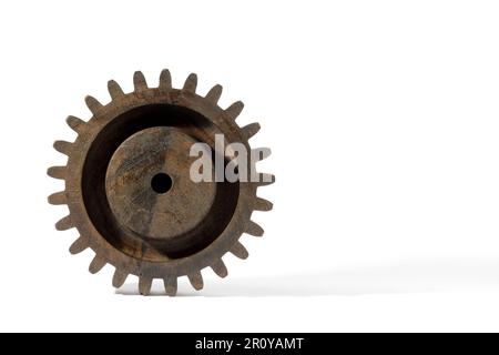Simple wooden round shaped gear wheel with hole in center isolated on white background Stock Photo