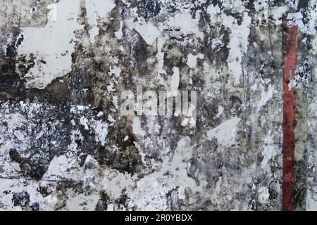 Scraps of torn paper in old bulletin board, grunge background Stock Photo