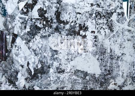 Scraps of torn paper in old bulletin board, grunge background Stock Photo