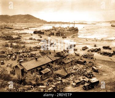 Invasion of Ichon, Korea. Four LST's unload men and equipment on beach ...