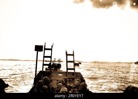 Carrying scaling ladders, U.S. Marines in landing crafts head for the seawall at Inchon.  September 15, 1950.  Photo by S.Sgt. W. W. Frank.  (Marine Corps) Stock Photo