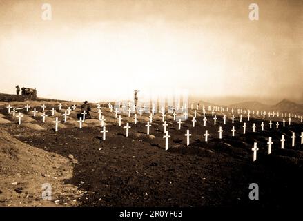 Marines of the First Marine Division pay their respects to fallen buddies during memorial services at the division's cemetery at Hamhung, Korea, following the break-out from Chosin Reservoir, December 13, 1950.  Photo by Cpl. Uthe. (Marine Corps) Stock Photo