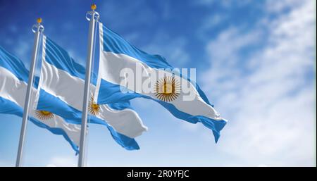 Three Argentine flags fluttering in the wind on a sunny day. Three equal blue and white horizontal bands with the Sun of May in the center. 3d illustr Stock Photo