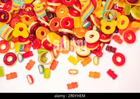 Assorted colorful gummy candies. Top view. Jelly donuts. Jelly bears. Isolated on a white background. Stock Photo