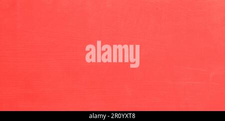 Red wall, texture, background. The wooden wall, painted with enamel paint. Flat surface in reddish color. Smooth and glossy surface Stock Photo