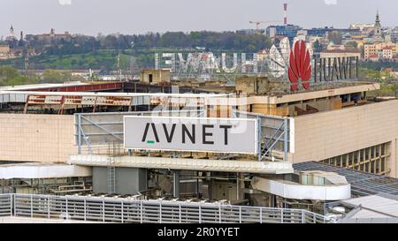 Belgrade, Serbia - April 09, 2023: Avnet Electronic and Huawei Technology Company Signs at Top of Office Buildings. Stock Photo