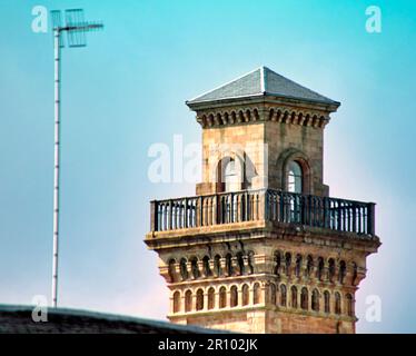the roman tower of trinity college church park circus contrasted with a television aerial Stock Photo