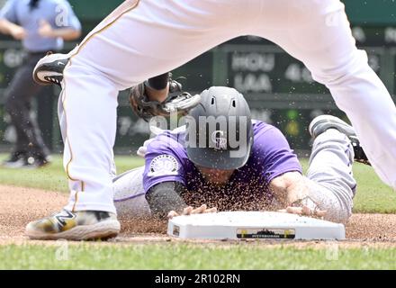 Pittsburgh, United States. 10th May, 2023. Colorado Rockies catcher Austin Wynns (16) slides into third base safely during the fourth inning against the Pittsburgh Pirates at PNC Park on Wednesday May 10, 2023 in Pittsburgh. Photo by Archie Carpenter/UPI Credit: UPI/Alamy Live News Stock Photo