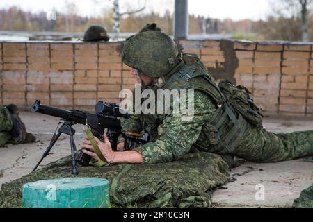 Man shooting at a target. Unformal shooting range  Stock Photo