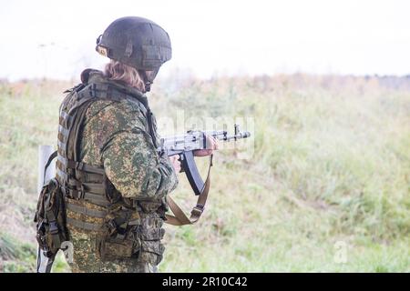 Man shooting at a target. Unformal shooting range  Stock Photo