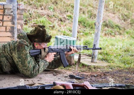 Man shooting at a target. Unformal shooting range  Stock Photo