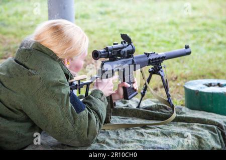 Man shooting at a target. Unformal shooting range  Stock Photo