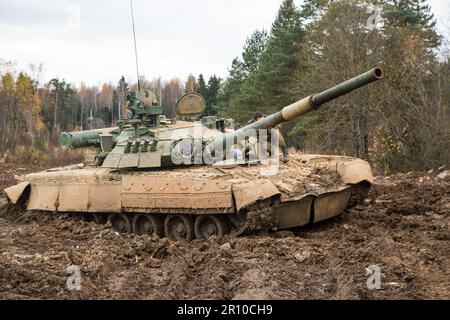 Russian tank rides on a forest road Stock Photo