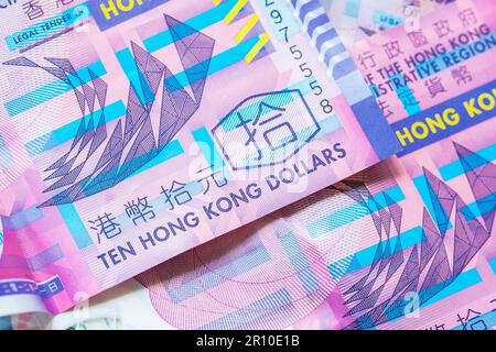 Detail of 10 ten Hong Kong dollar bills close up. Abstract finance background. Translation: Ten Hong Kong dollars Stock Photo