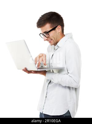 Trying to meet deadlines. A nerdy hipster touching the keys on his laptop with a white background. Stock Photo