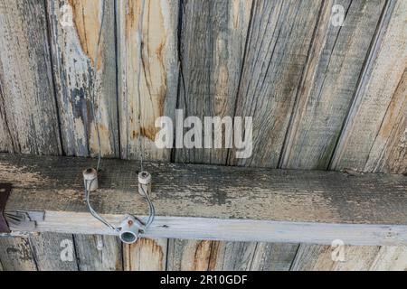 Early 1900s tube and knob electrial wiring at the train station at the Nevada ghost town of Rhyolite. Stock Photo