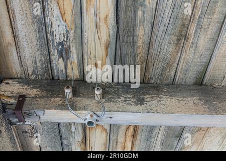 Early 1900s tube and knob electrial wiring at the train station at the Nevada ghost town of Rhyolite. Stock Photo