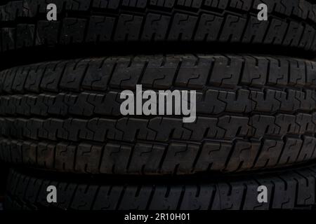 Clean dark new black tire detail texture background. Use for web, landing page background, flyer, brochure, print. Stock Photo