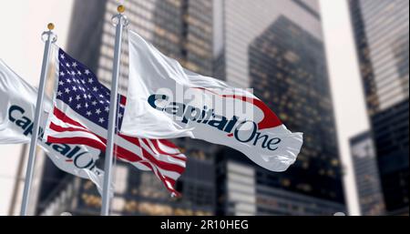 New York, US, April 2023: Capital One bank flags waving in a financial district. Capital One Q1 2023 profit missed estimates due to provisions. Illust Stock Photo