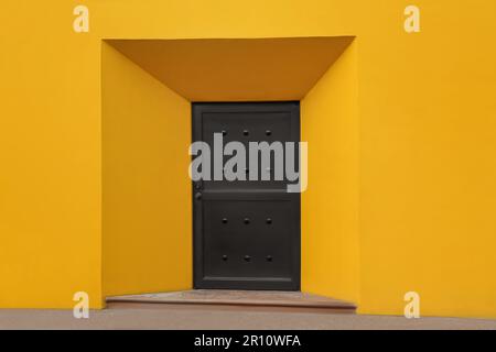 Entrance of house with beautiful brown metal door Stock Photo
