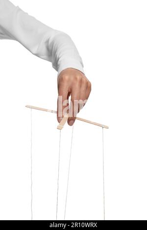 Woman pulling strings of puppet on white background, closeup Stock Photo