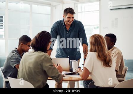 I cant wait to share my ideas with the team. a diverse group of businesspeople having a meeting in the office together during the day. Stock Photo