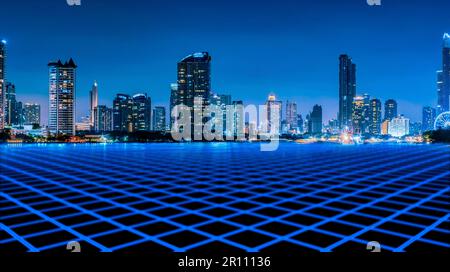 Cityscape of modern building at night with blue empty floor in front of building. Modern architecture office building. Skyscraper building with night Stock Photo