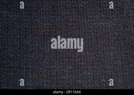 top view, close up of woven fabric containing dark blue, light blue, and black; textile Stock Photo