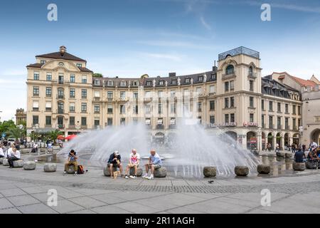 MUNICH, GERMANY, JUNE 4: Tourists at Stachus fountain in Munich, Germany on June 4, 2014. Munich is the biggest city of Bavaria with almost 100 Stock Photo