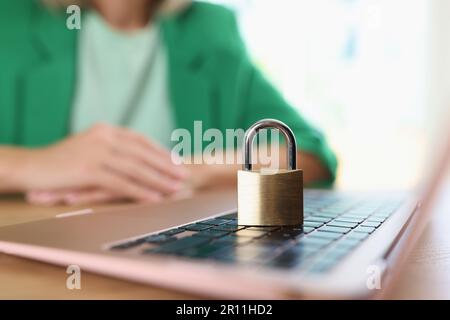 Closed metal padlock on modern laptop, personal data protection symbol Stock Photo
