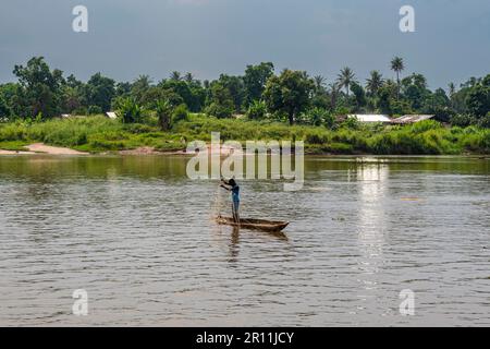 Fisherman in his dugout canoe, Wagenya tribe, Kisangani, Congo river, DR Congo Stock Photo