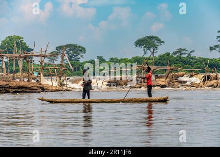 Fishermen in their dugout canoe, Wagenya tribe, Kisangani, Congo river, DR Congo Stock Photo