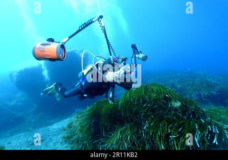 Underwater photographer in the Mediterranean, underwater camera, underwater photography, underwater photos Stock Photo