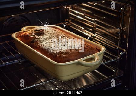 Plum cake baked in the oven in ceramic form. Stock Photo