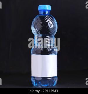 bottled pure water mockup isolated black background, water bottle 500ml mockup photography Stock Photo