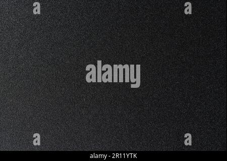 Grainy dark matte metal texture background close up view Stock Photo