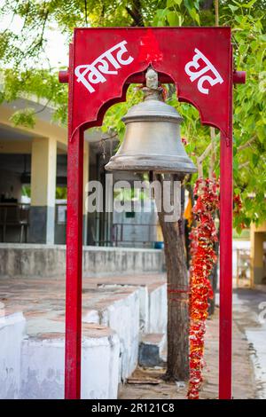 hindu holy bell at temple at evening from flat angle image is taken at santoshi mata mandir jodhpur rajasthan india on May 05 2023. Stock Photo