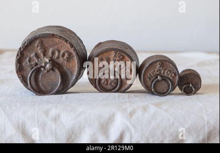 Old vintage iron weights for scale. Items weight engraved in high relief Stock Photo