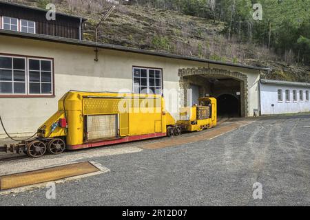 Miners’ transportation railway entering a mine gallery, Rammelsberg mine site, Goslar, Harz, Lower-Saxony, Germany Stock Photo