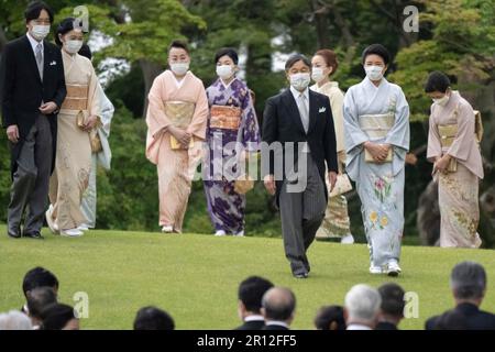 Japan s Emperor Naruhito front left and Empress Masako front