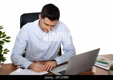 businessman in blue shirt taking notes, doing market research working Stock Photo