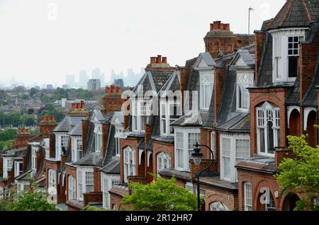 view of london skyline with olympic park and canary wharf distant from hillfield park red brick Victorian edwardian residential street muswell hill N10 north london england UK Stock Photo