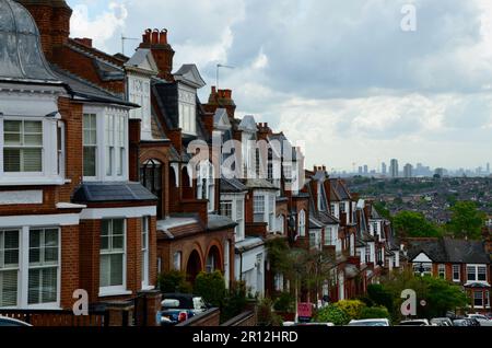 view of london skyline with olympic park and canary wharf distant from hillfield park red brick Victorian edwardian residential street muswell hill N10 north london england UK Stock Photo