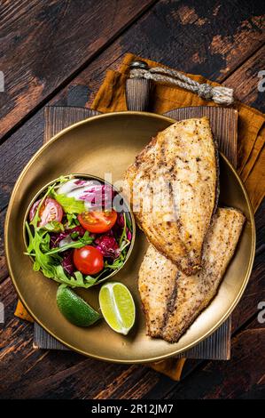 Roasted Gilthead Sea Bream fillets served with fresh vegetable salad ...