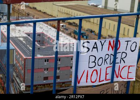 The Falmouth community holds an emergency protest in solidarity with refugees as the controversial Bibby Stockhold arrives in Port Stock Photo