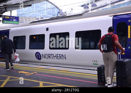 Manchester, UK, 11th May, 2023. Northern Rail has said 'a minority' of passengers viewed content which was 'not suitable' for its services. This included 'inappropriate jokes,' offensive topics and 'bad language,' said the company. Regional director Chris Jackson said Northern Rail was giving passengers 'a gentle reminder on etiquette'. Northern said passengers should consider any material deemed 'not safe for work' unsuitable for its trains and stations. A train at Piccadilly Railway Station, Manchester. Credit: Terry Waller/Alamy Live News Stock Photo