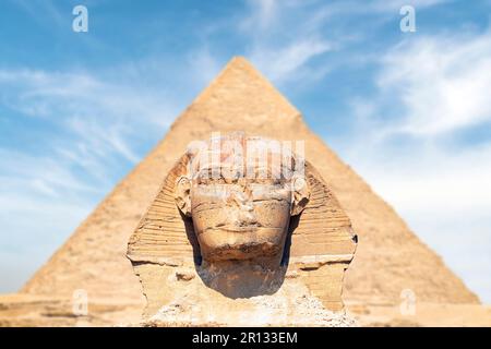 Great Sphinx is the oldest monument in Giza Egypt. The head of the sphinx is precisely symmetrical against the background of the pyramid of Chephren. Stock Photo