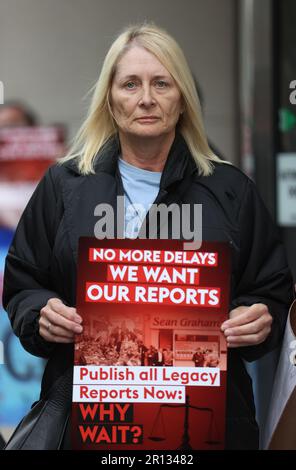 Patricia Burns, whose father Thomas Burns was shot dead by a British soldier in 1972 with Time for Truth and Justice campaigners during a protest against the Northern Ireland Troubles (Legacy and Reconciliation) Bill outside the Northern Ireland Office (NIO) at Erskine House in Belfast. Picture date: Thursday May 11, 2023. Stock Photo