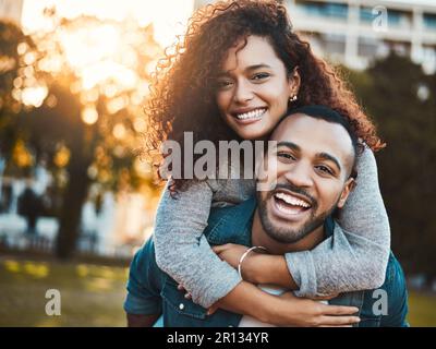 Let love bring joy into your life. Portrait of a young couple having fun together outdoors. Stock Photo