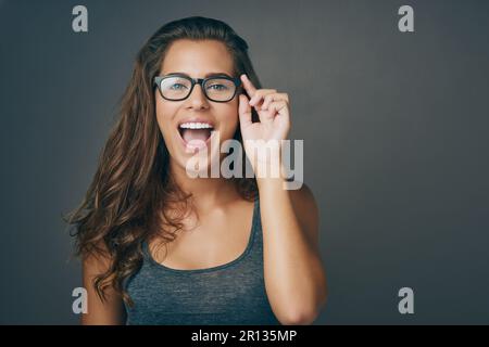 Life is too short to wear ugly glasses. Studio shot of an attractive young woman wearing glasses. Stock Photo